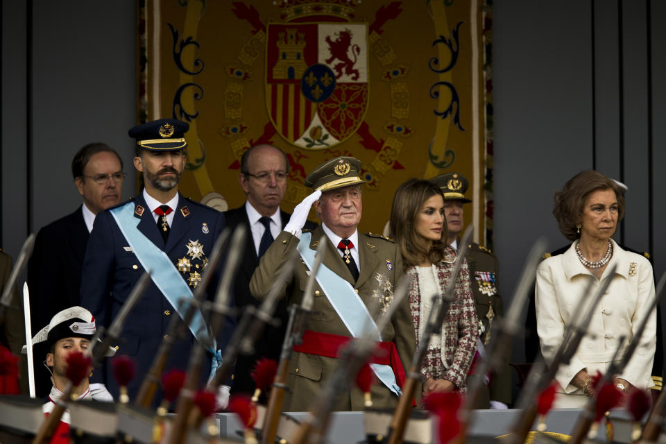 Spain's Crown Prince Felipe, left, Spain's King Juan Carlos, center left, Princess Letizia and Queen Sofia, right, attend a military parade, during the holiday known as Dia de la Hispanidad, Spain's National Day, in Madrid, Friday, Oct. 12, 2012. King Juan Carlos presided over a much reduced parade that featured none of the usual fighter jets or tanks as they celebrate the day Christopher Columbus discovered America in the name of the Spanish Crown.(AP Photo/Daniel Ochoa de Olza)