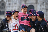 Britain’s Tao Geoghegan Hart celebrates with teammates after winning the Giro d'Italia cycling race, in Milan, Italy, Sunday, Oct. 25, 2020. In one of the most exciting final stages of a Grand Tour, British rider Tao Geoghegan Hart won the Giro d’Italia on Sunday, edging out Australian Jai Hindley by just 39 seconds. (Marco Alpozzi/LaPresse via AP)