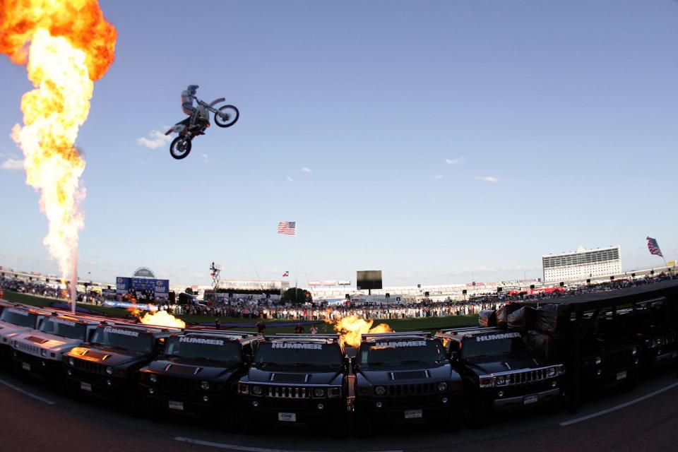 Motorcycle daredevil "Kaptain" Robbie Knievel jumps, 20 Hummer H2 SUVs prior to the IRL IndyCar Series Bombardier Learjet 550k on June 7, 2008 at the Texas Motor Speedway in Fort Worth, Texas.