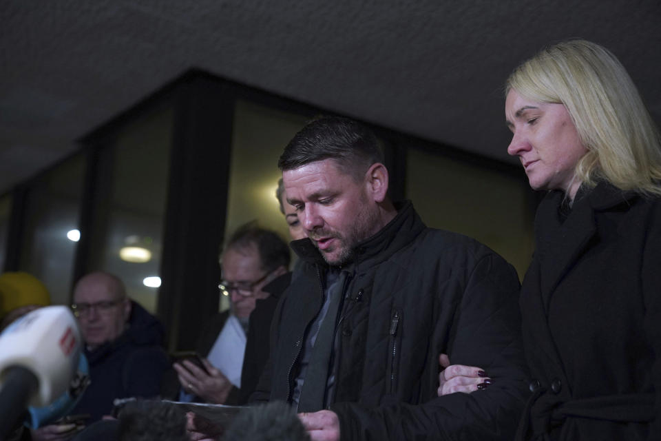 Peter Spooner, father of Brianna Ghey, makes a statement to the waiting media next to his wife Esther Ghey, after a boy and a girl, both 16, have been found guilty of the murder of teenager Brianna Ghey, outside Manchester Crown Court, Wednesday Dec. 20, 2023. Brianna, 16, was stabbed with a hunting knife in a park in Culcheth, near Warrington, on the afternoon of February 11. (Peter Byrne/PA via AP)