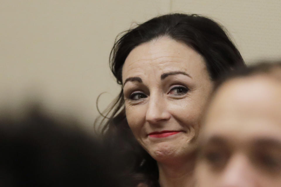 Juliette Parker waits to appear in court, Tuesday, Feb. 18, 2020, in a Pierce County courtroom in Tacoma, Wash. Parker, who is accused of posing as a baby photographer in a plot to steal a mother's baby, pleaded not guilty Tuesday to charges of assault and attempted kidnapping. The judge on the case raised her bail from $50,000 to $150,000, and she was re-booked into the Pierce County Jail. (AP Photo/Ted S. Warren)