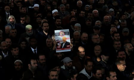 FILE PHOTO: People attend a symbolic funeral prayer for Saudi journalist Jamal Khashoggi at the courtyard of Fatih mosque in Istanbul