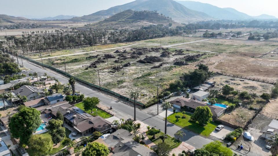 An aerial of empty land where more than 100 homes were razed.