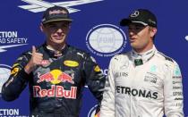 Belgium Formula One - F1 - Belgian Grand Prix 2016 - Francorchamps, Belgium - 27/8/16 - Mercedes' Nico Rosberg of Germany (R) reacts after qualifying in pole position ahead of Red Bull's Max Verstappen of the Netherlands. REUTERS/Yves Herman