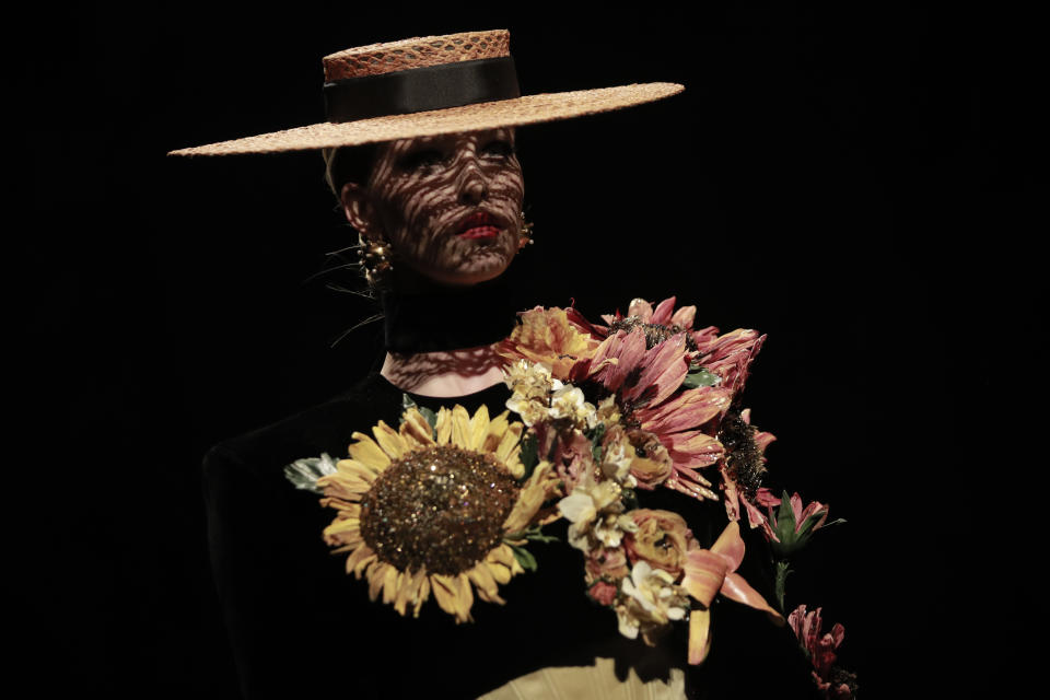 A model wears a creation for Schiaparelli's Haute Couture Fall/Winter 2022-2023 fashion collection, Monday, July 4, 2022 in Paris. (AP Photo/Lewis Joly)