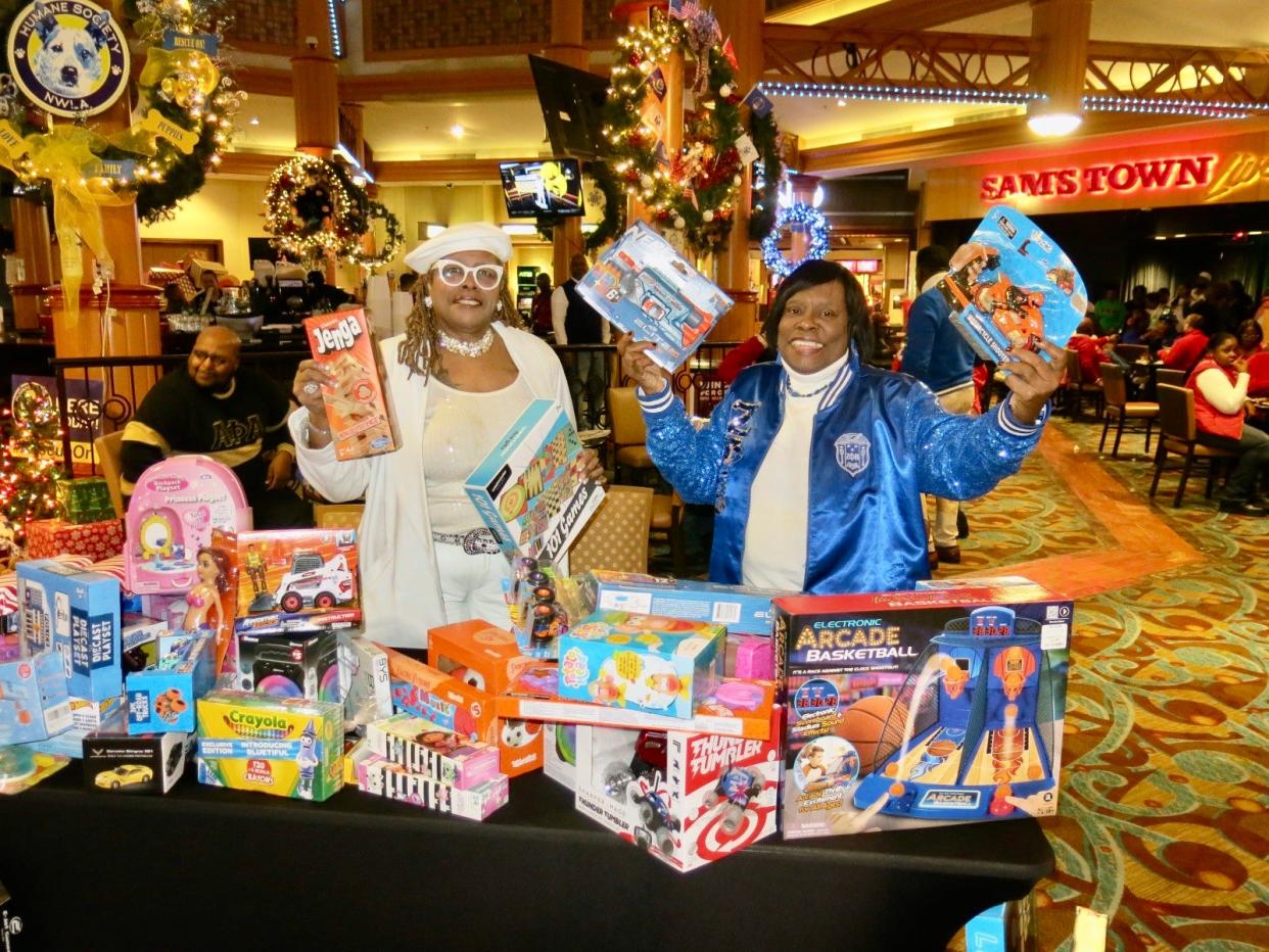 Party With a Purpose event at Sam's Town: Leveda Palms and Dottie Bell with toys for homeless children attending Caddo Parish schools pre-K to high school.