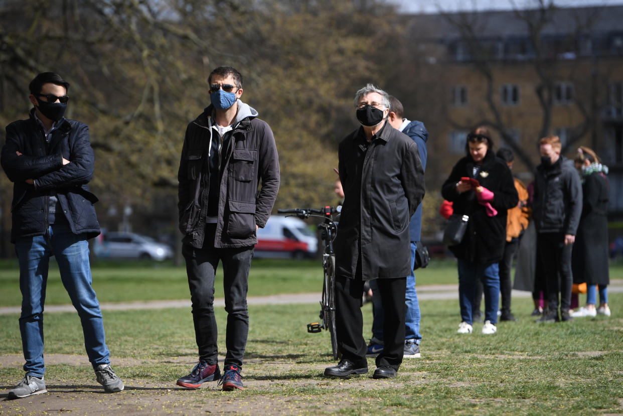 People stand in line for coronavirus surge testing on Clapham Common, south London. Thousands of residents have queued up to take coronavirus tests at additional facilities set up after new cases of the South African variant were found in two south London boroughs. 44 confirmed cases of the variant have been found in Lambeth and Wandsworth, with a further 30 probable cases identified. Picture date: Wednesday April 14, 2021.