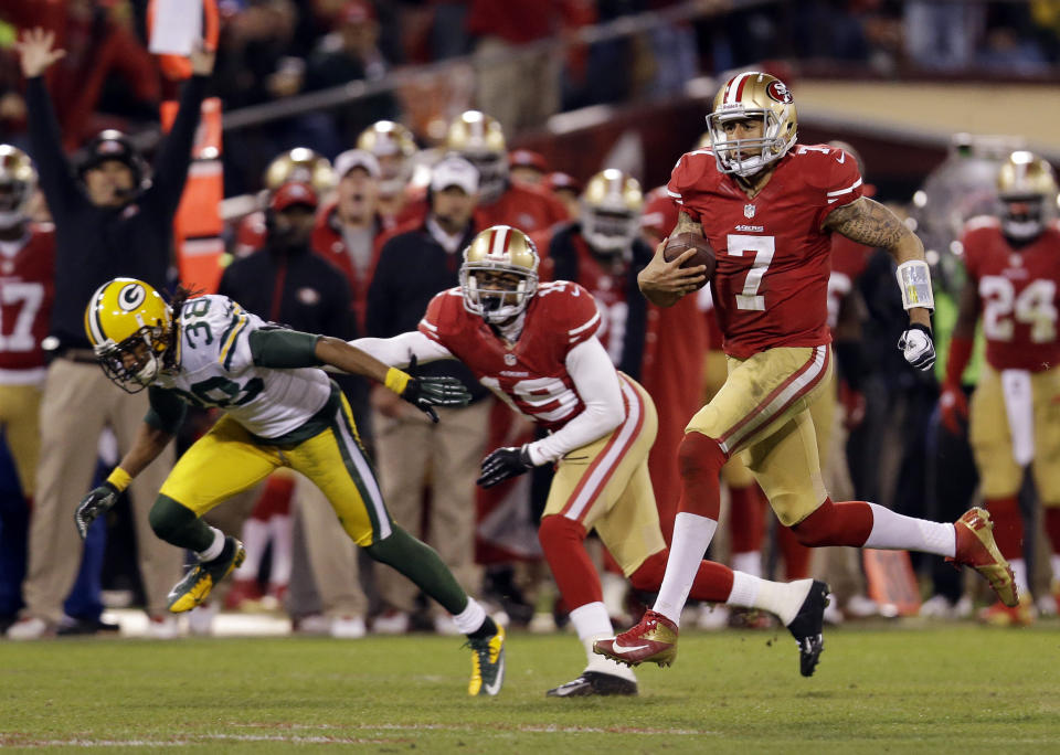 FILE - In this Jan. 12, 2013, file photo, San Francisco 49ers quarterback Colin Kaepernick (7) runs for a 56-yard touchdown against the Green Bay Packers during the third quarter of an NFC divisional playoff NFL football game, in San Francisco. The two teams that have combined for nine Super Bowl titles will meet with a spot in the ultimate game on the line once again when the 49ers (14-3) host the Packers (14-3) in the NFC championship game on Sunday, Jan. 19, 2020. (AP Photo/Marcio Jose Sanchez, File)