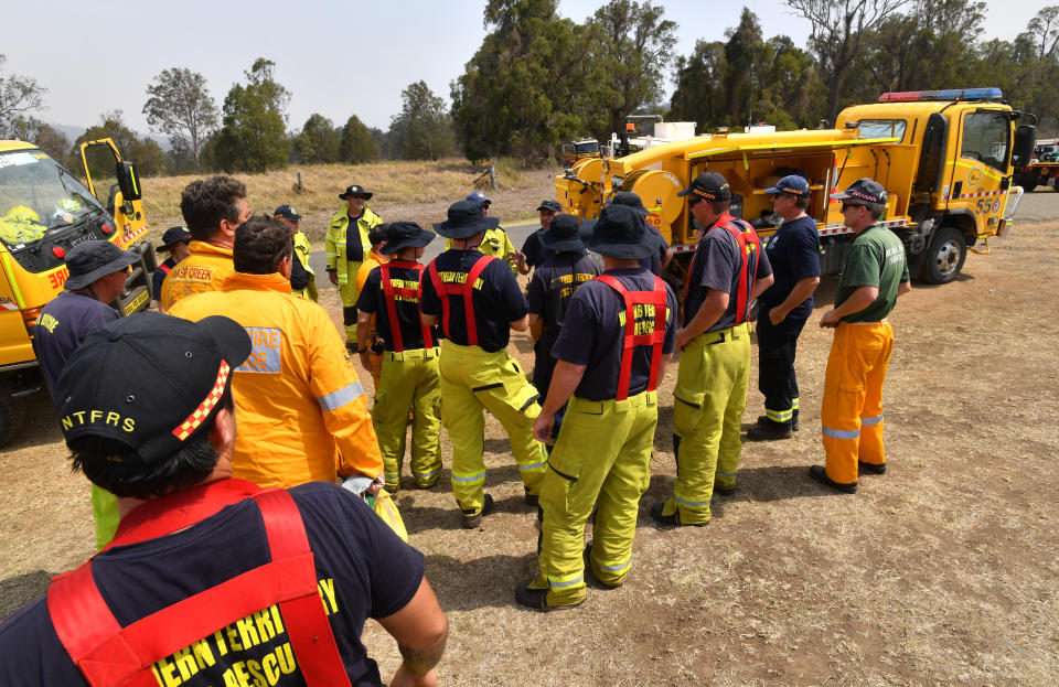 Rural firefighters prepare for another exhausting day at Spicers Gap, south west of Brisbane yesterday. Source: AAP