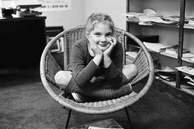 <p>Ron Burton/Mirrorpix/Getty</p> Drew Barrymore in November 1982, shortly after she hosted 'SNL' at age 7.