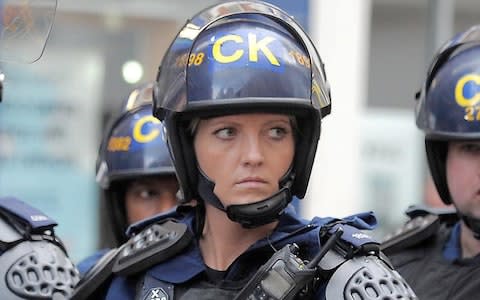 PC Kerry Reeve pictured during the Manchester riots in 2011  - Credit: Paul Cousans/Zenpix Ltd