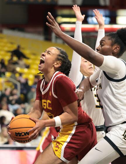 Long Beach, California December 21, 2023- USC's McKenzie Forbes drives past.