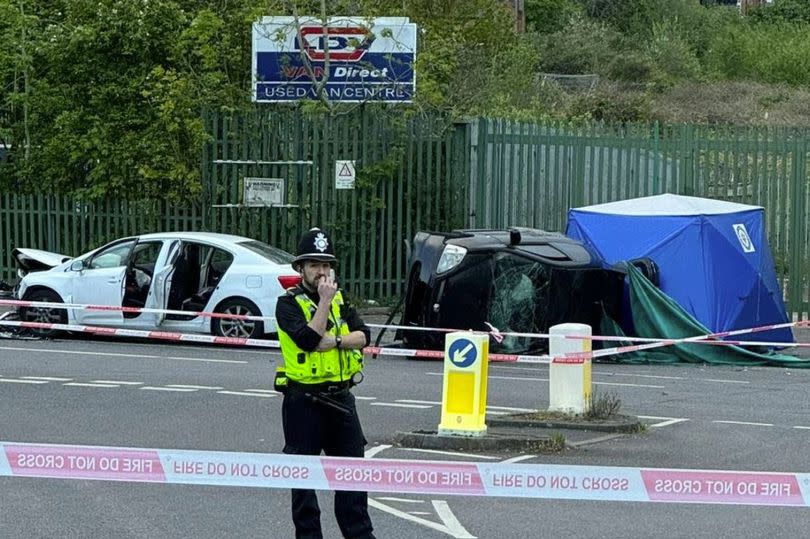 Police guard the collision scene as officers set up forensic tent -Credit:BirminghamLive