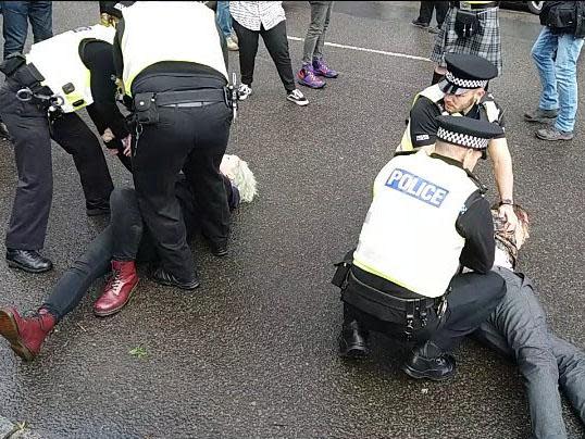 Police restrain protesters at Glasgow Pride: Mat Wilkie