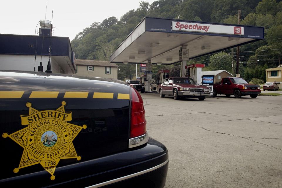 A Kanawha County Sheriff's car sits outside the gas station August 19, 2003 in Campbells Creek, West Virginia.