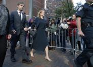 Felicity Huffman leaves federal court with her husband William H. Macy after she was sentenced in a nationwide college admissions bribery scandal, Friday, Sept. 13, 2019, in Boston. (AP Photo/Michael Dwyer)