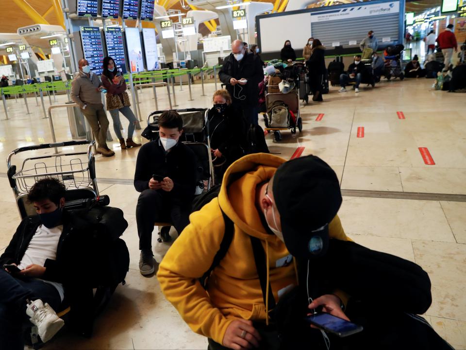 Stranded passengers wait for news about their flights at Adolfo Suarez Barajas airport, which is suspending flights due to heavy snowfall in MadridREUTERS