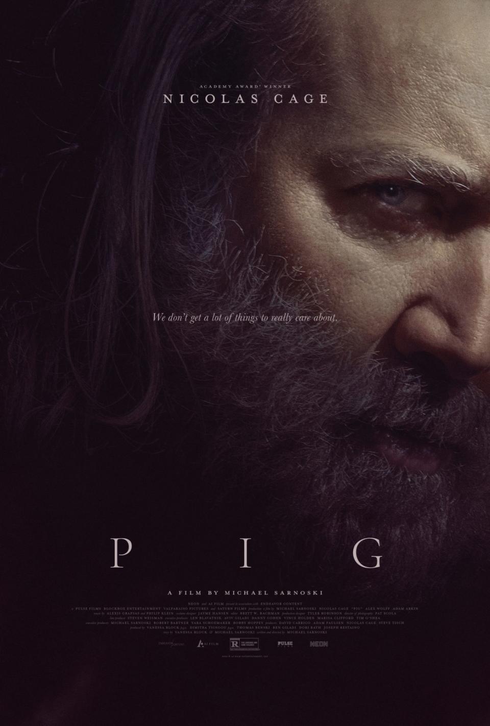 Nicolas Cage's face on the dark, shadowy poster for the movie Pig.