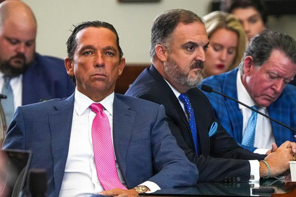 Tony Buzbee, left, and Mitch Little, right, attorneys for Attorney General Ken Paxton, listen as votes are read out loud in the impeachment trial of Paxton at the Texas Capitol on Saturday, Sep. 16, 2023.