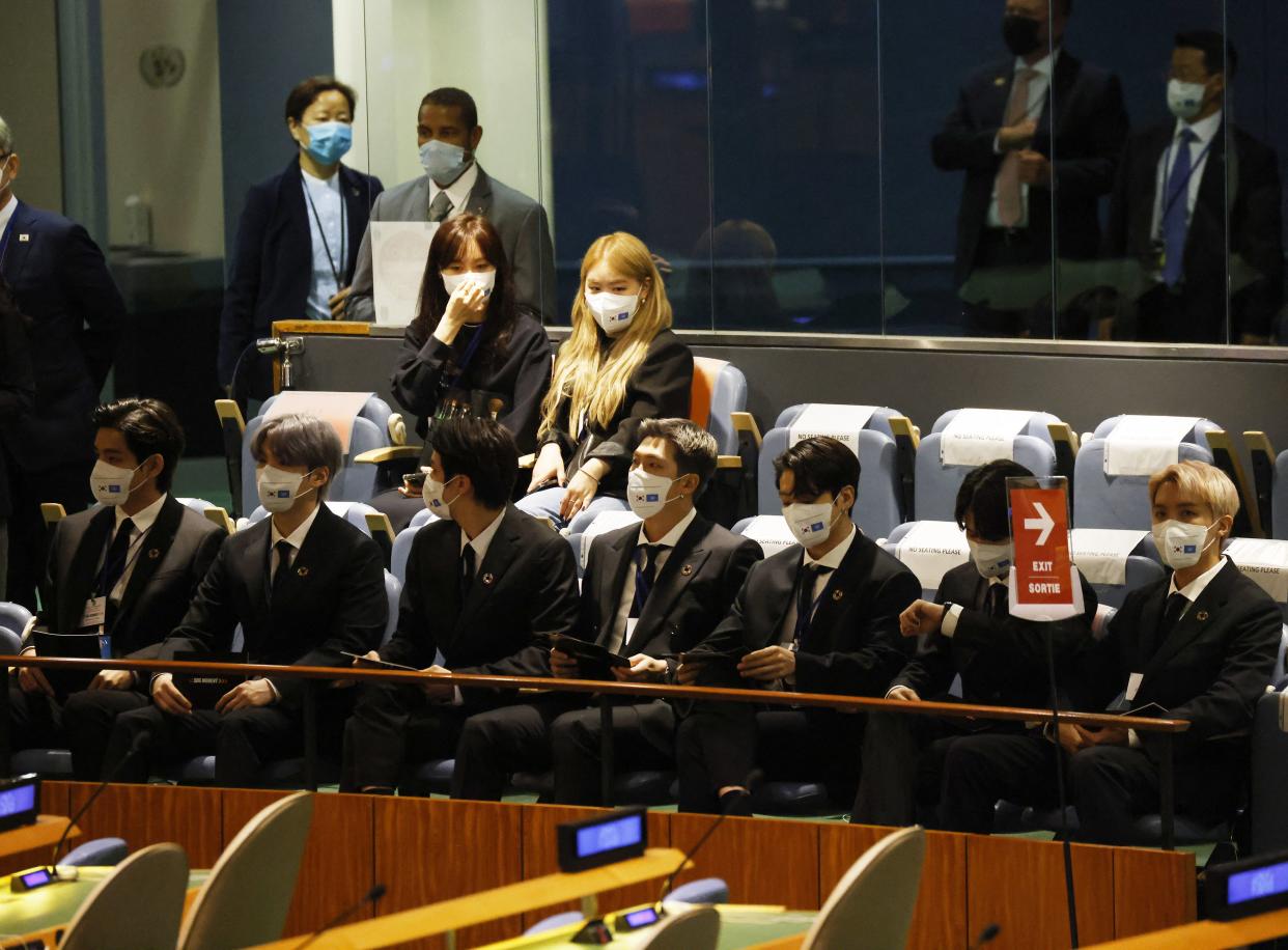 Members of the South Korean boy band BTS wear face masks before they take turns speaking at the SDG Moment event as part of the UN General Assembly 76th session General Debate at United Nations Headquarters on Sept. 20, 2021, in New York.