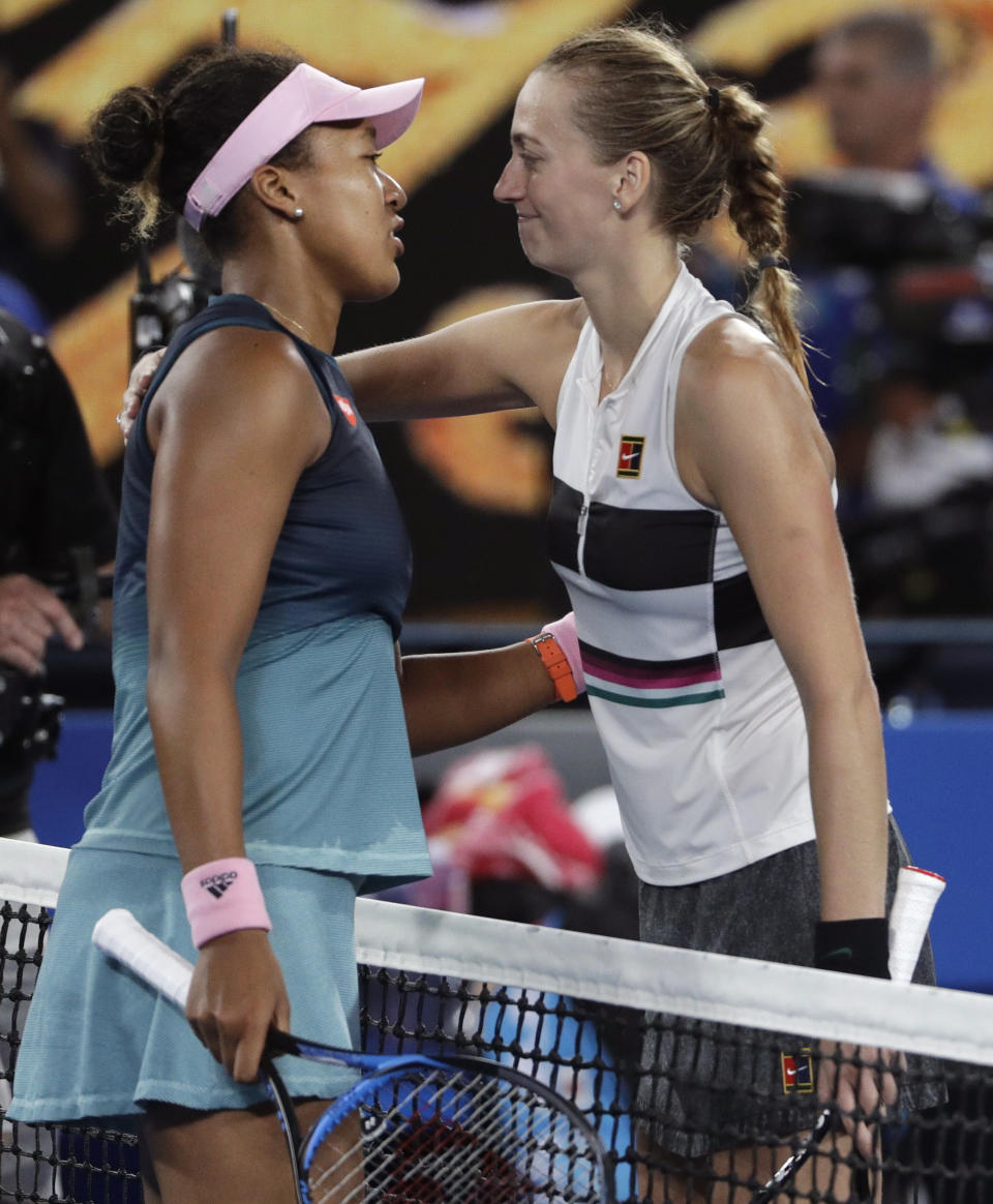 Japan's Naomi Osaka, left, is congratulated by Petra Kvitova of the Czech Republic after winning their women's singles final at the Australian Open tennis championships in Melbourne, Australia, Saturday, Jan. 26, 2019. (AP Photo/Mark Schiefelbein)