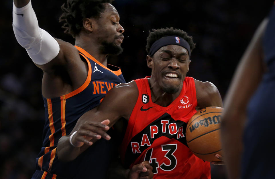 Toronto Raptors forward Pascal Siakam (43) drives past New York Knicks forward Julius Randle, left, during the first half of an NBA basketball game Wednesday, Dec. 21, 2022, in New York. (AP Photo/John Munson)