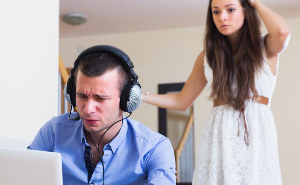 Unhappy woman suspecting spouse spending money on games online