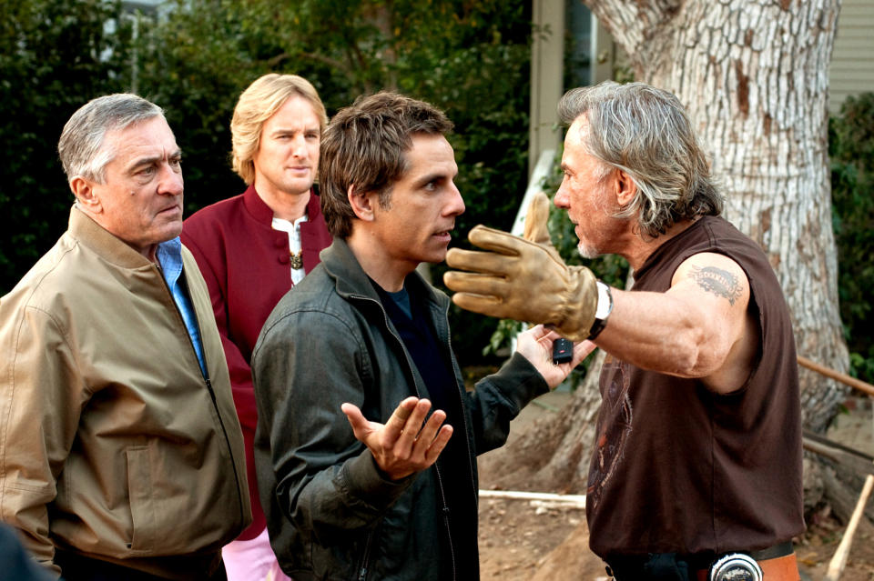 Robert De Niro, Owen Wilson, Ben Stiller, Harvey Keite outside while one of the characters has their hands out while talking to ben stiller