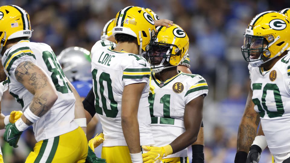 Jordon Love and Packers wide receiver Jayden Reed celebrate a touchdown against the Detroit Lions. - Mike Mulholland/Getty Images
