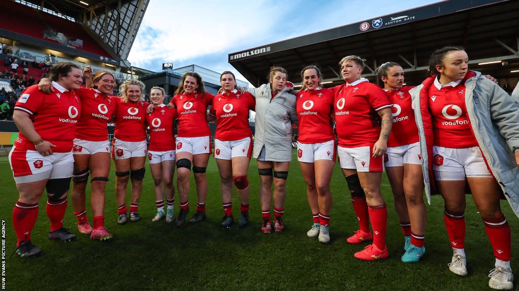 Wales players come together after defeat to England