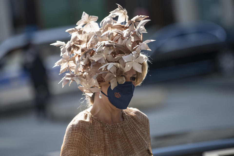 Queen Maxima of the Netherlnds arrives at the Reichstag building of the German Bundestag wearing a striking hat in Berlin, Germany, Tuesday, July 6, 2021. The Dutch royal couple is in Berlin for a three-day state visit. (Fabian Sommer/dpa via AP)