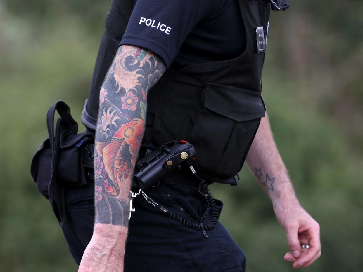 File photo dated 29/08/16 of a police officer with visible tattoos: PA