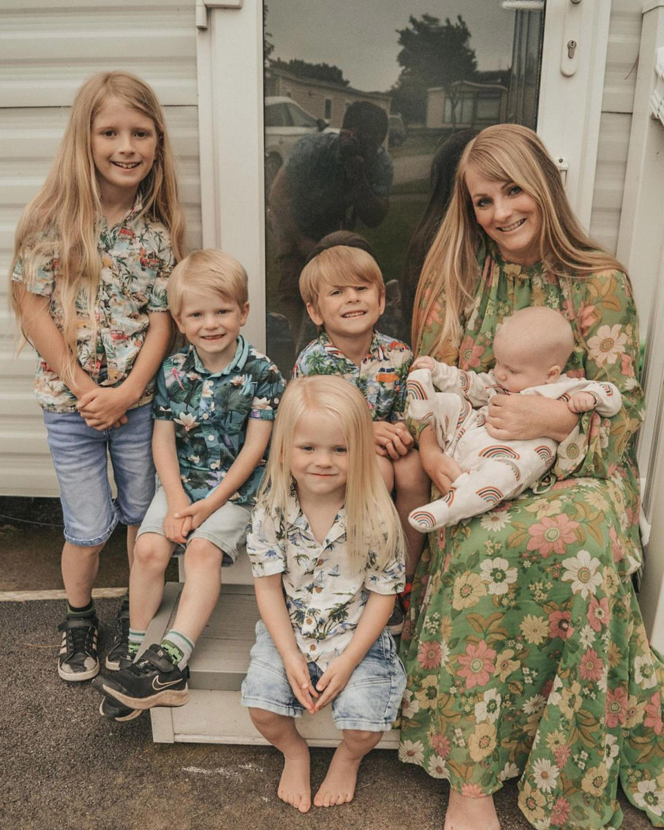 Rachael Cresswell says her sons' long hair suits their personality, pictured (L-R) Jaxon, Noah, Bodhi, Cole alongside mum Rachael Cresswell and baby brother Leif. (Caters)