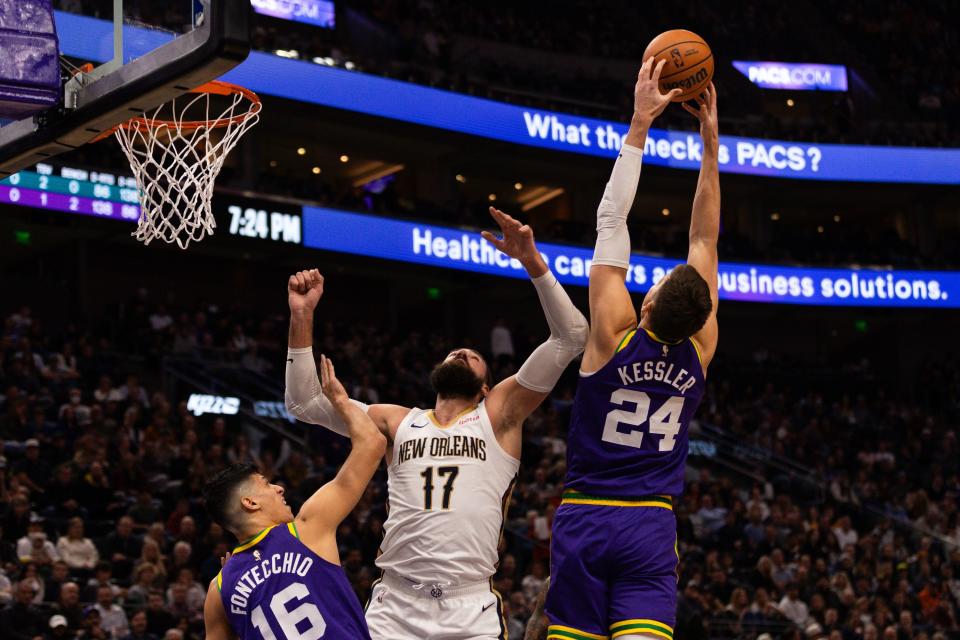 Utah Jazz center Walker Kessler (24) jumps for the rebound over New Orleans Pelicans center Jonas Valanciunas (17) and Utah Jazz forward Simone Fontecchio (16) during an NBA basketball game between the Utah Jazz and the New Orleans Pelicans at the Delta Center in Salt Lake City on Monday, Nov. 27, 2023. | Megan Nielsen, Deseret News