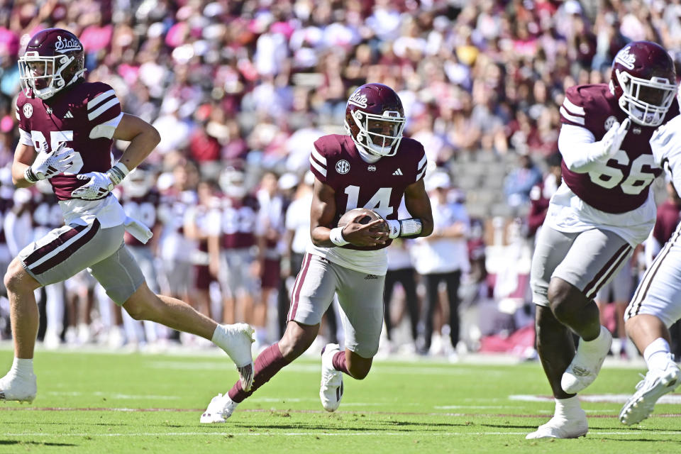 Oct 7, 2023; Starkville, Mississippi, USA; Mississippi State Bulldogs quarterback <a class="link " href="https://sports.yahoo.com/ncaaf/players/312773" data-i13n="sec:content-canvas;subsec:anchor_text;elm:context_link" data-ylk="slk:Mike Wright;sec:content-canvas;subsec:anchor_text;elm:context_link;itc:0">Mike Wright</a> (14) runs the ball against the Western Michigan Broncos during the first quarter at Davis Wade Stadium at Scott Field. Mandatory Credit: Matt Bush-USA TODAY Sports