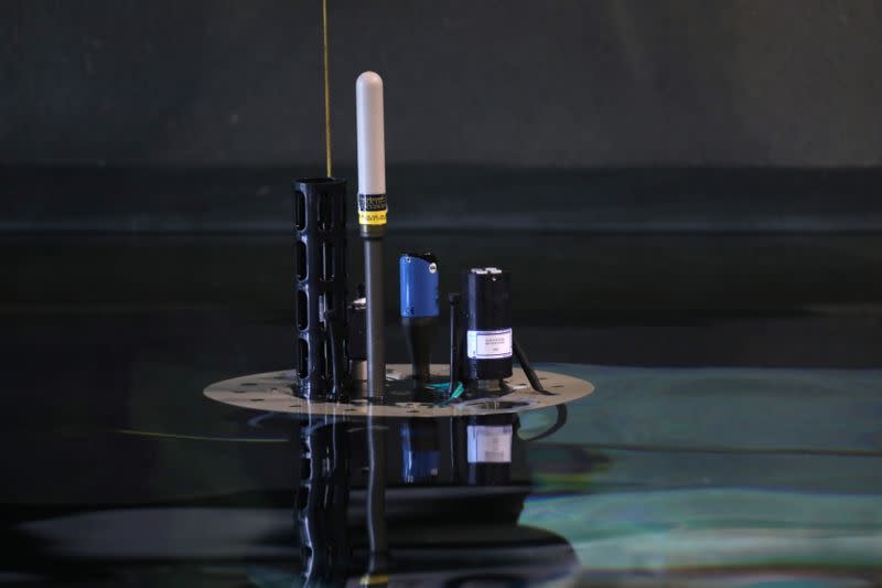 The top of a robotic near-shore ocean float is seen floating in a test tank at the Monterey Bay Aquarium Research Institute in Moss Landing