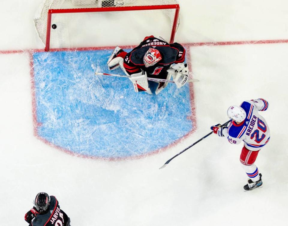 New York Rangers left wing Chris Kreider (20) scores on the power play on Carolina Hurricanes goaltender Frederik Andersen (31) to tie the score 3-3 in the third period during Game 6 in the second round of the 2024 Stanley Cup playoffs on Thursday, May 16, 2024 at PNC Arena in Raleigh N.C.