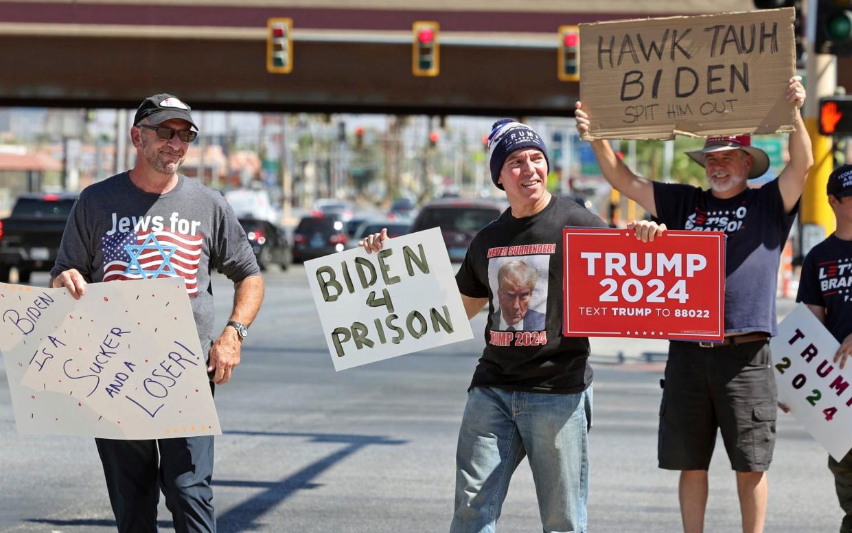 Trump supporters protest near the location where Vice President Kamala Harris is scheduled to speak