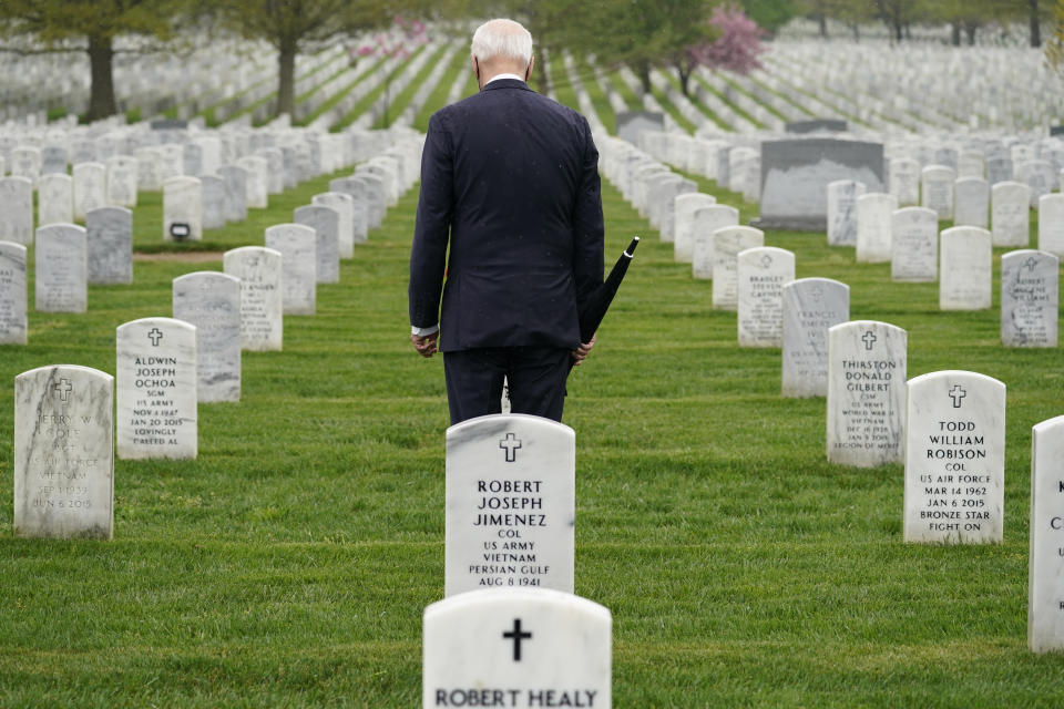 President Joe Biden visits Section 60 of Arlington National Cemetery in Arlington, Va., on Wednesday, April 14, 2021. Biden announced the withdrawal of the remainder of U.S. troops from Afghanistan by Sept. 11, 2021, the 20th anniversary of the terrorist attacks on America. (AP Photo/Andrew Harnik)