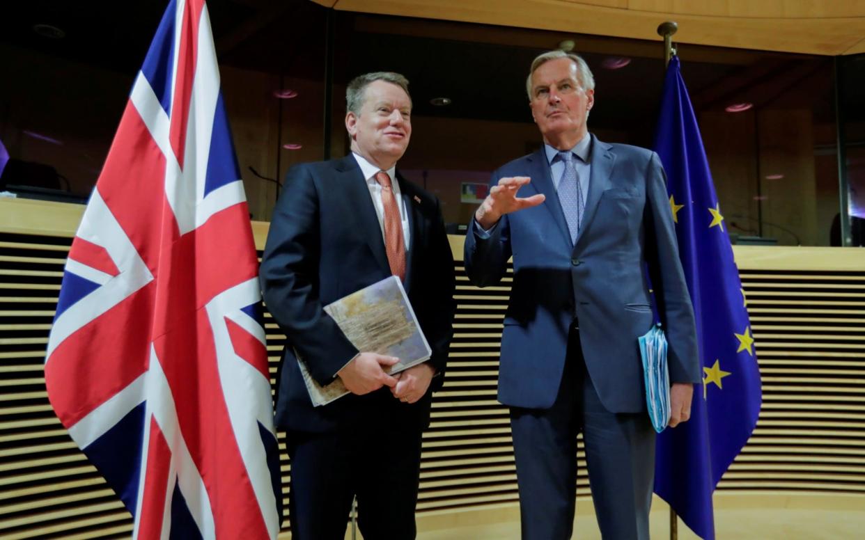 The European Union's chief Brexit negotiator Michel Barnier and British negotiator David Frost at the start of post -Brexit trade deal talks - Oliver Hoslet/Pool via REUTERS