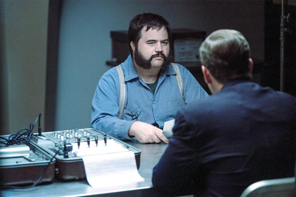 Paul Walter Hauser as convicted serial killer Larry Hull on the Apple TV+ true-crime limited series Black Bird.