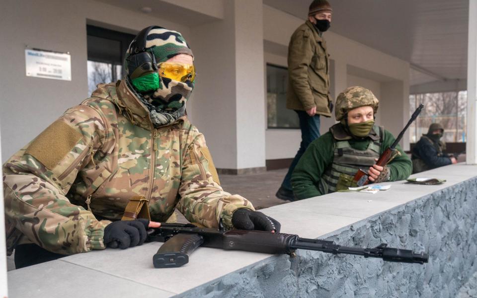 Armed Ukrainian civilians have begun to patrol Kyiv on the second day of the Russian invasion - Alex Lourie