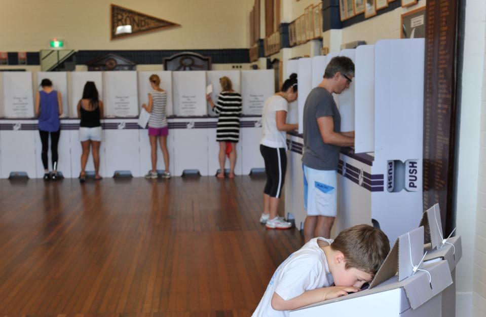 Residents cast their vote at Bondi Surf Bathers Life Saving Club on the morning of the Federal Election in Sydney on Saturday, Sept. 7, 2013. (AAP Image/Paul Miller)