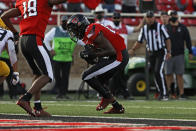 Texas Tech's Trey Cleveland (85) runs the ball to score a touchdown during the first half of an NCAA football game against West Virginia, Saturday, Oct. 24, 2020, in Lubbock, Texas. (AP Photo/Brad Tollefson)