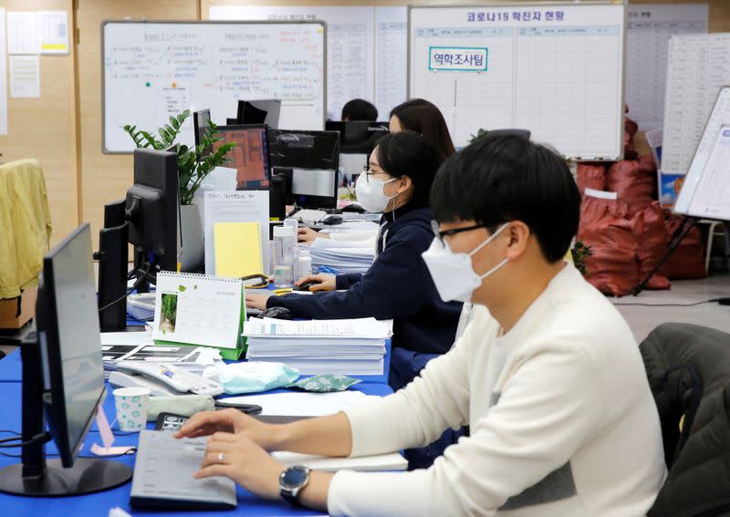 City employees work at Incheon city’s coronavirus response command center in Incheon