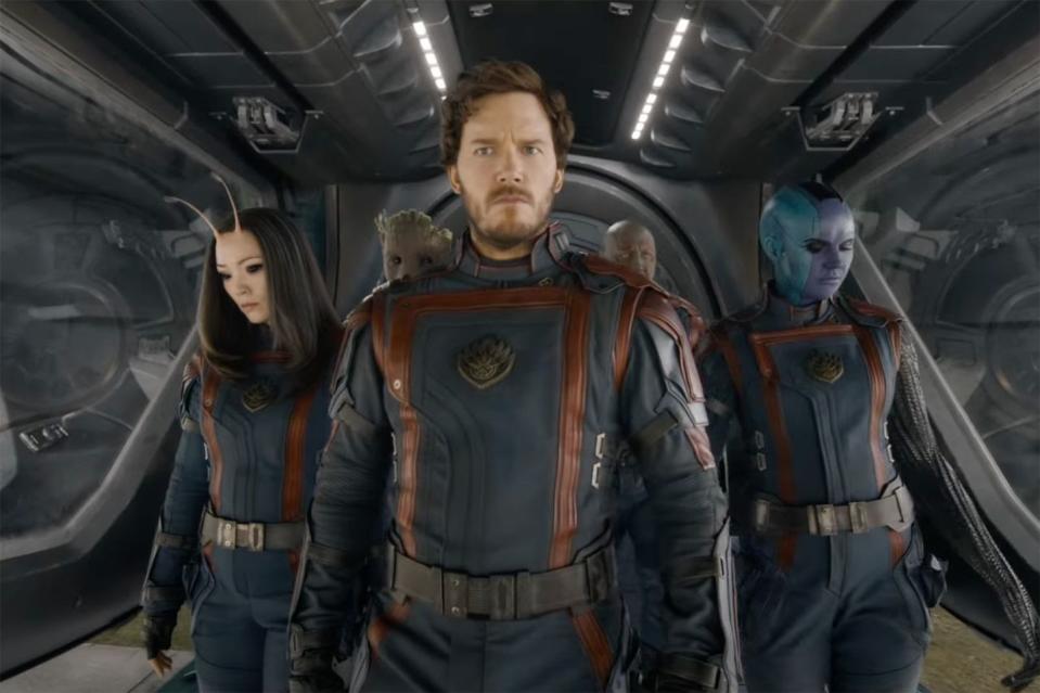 the guardians confidently walk in a line in a scene from guardians of the galaxy vol 3, the 32nd movie if you wanted tow watch the marvel mcu movies in order