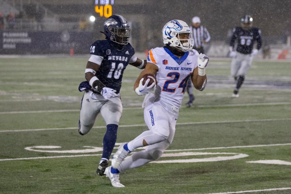 Boise State running back George Holani (24) runs for a touchdown against Nevada during the first half of an NCAA college football game in Reno, Nev., Saturday, Nov. 12, 2022. (AP Photo/Tom R. Smedes)