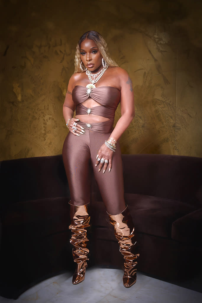 Mary J Blige rose gold mirrored boots