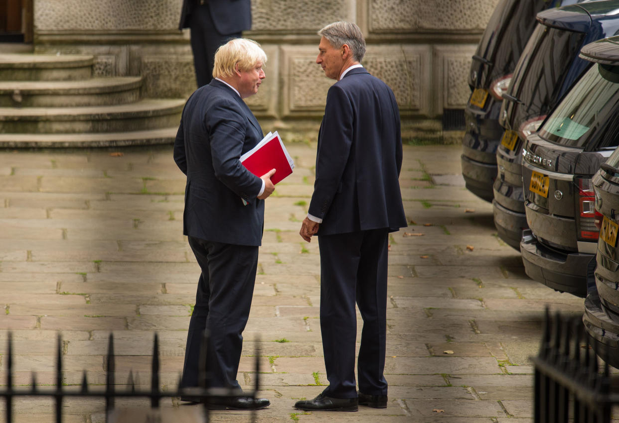 Boris Johnson, left, and Philip Hammond belong to rival Tory camps on Brexit. Photo: Dominic Lipinski/PA/Getty