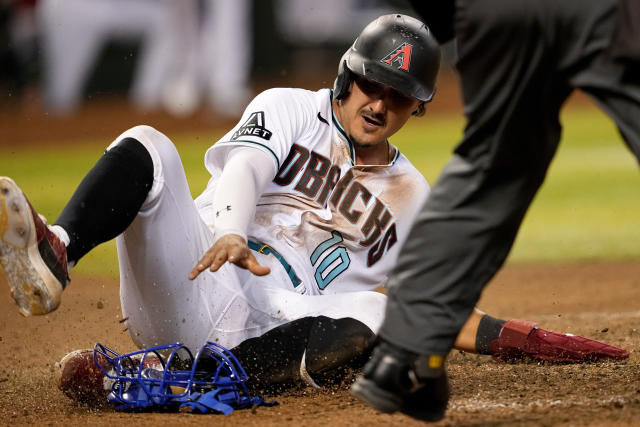 Arizona Diamondbacks' Ketel Marte walks back to the dugout after striking  out against the Los Angeles Dodgers during the first inning of a baseball  game Thursday, April 6, 2023, in Phoenix. (AP